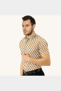 Man wearing a patterned shirt on a white background